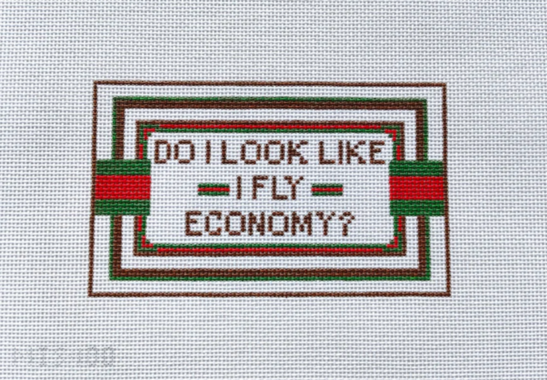 design with text 'Do I look like I fly economy?' on a white background needlepoint canvas