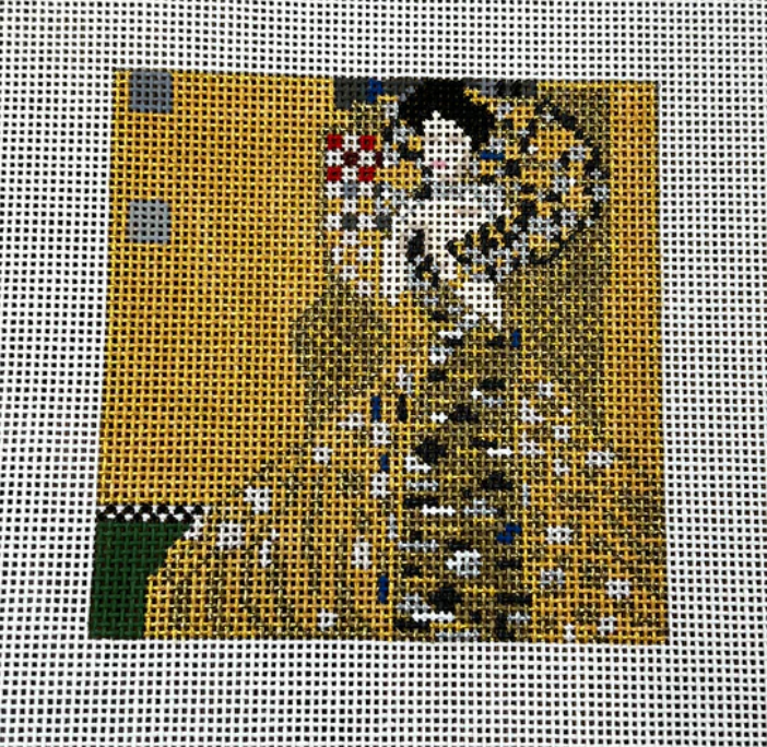 woman in gold needlepoint canvas